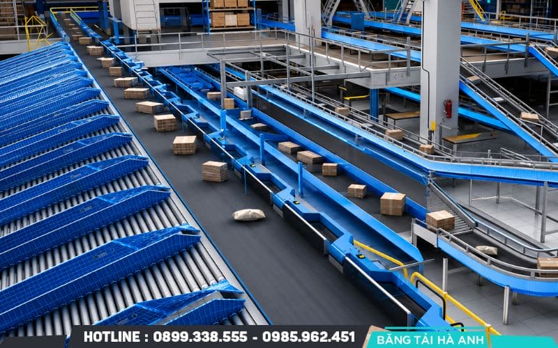 Tối ưu hóa tuyệt đối trong hệ thống băng tải là quá trình đánh giá và cải thiện đồng bộ các yếu tố ảnh hưởng đến hiệu suất vận hành